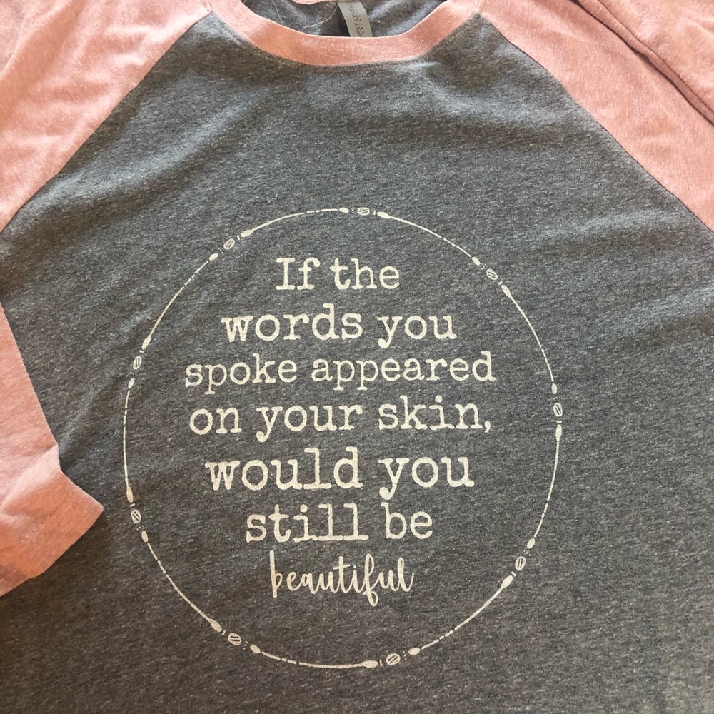 Pink and gray baseball t with words